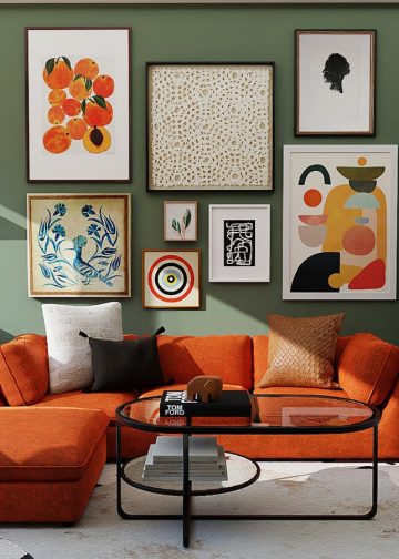 orange and black sofa with throw pillows